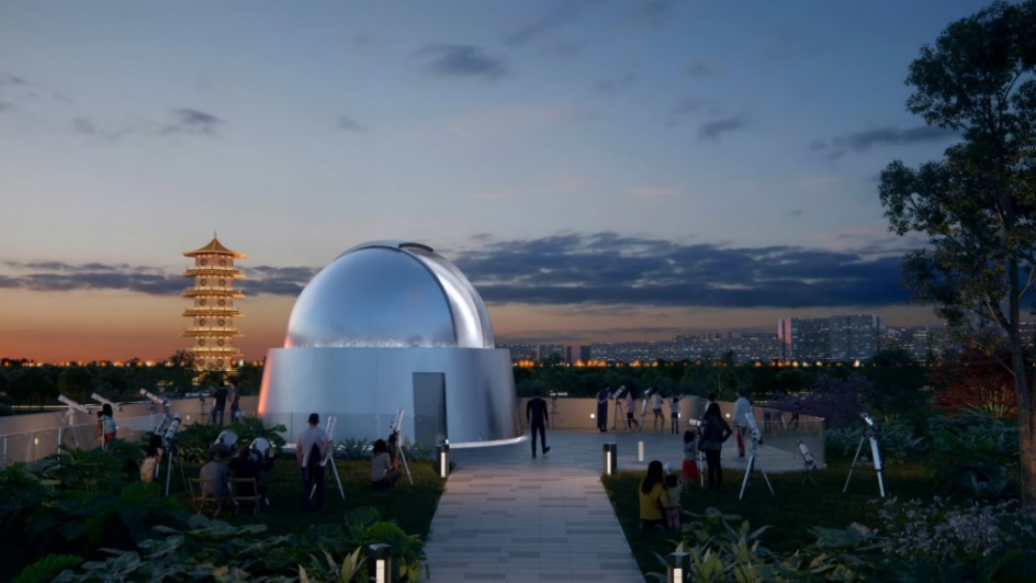 Crowd stargazing at the Observatory dome against a sunset skyline.